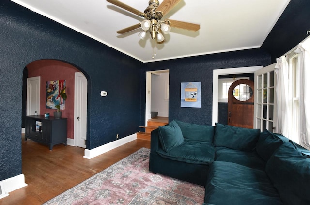 1032 Russet St, Racine, WI 53405 - living area featuring arched walkways, wood finished floors, ceiling fan, and crown molding