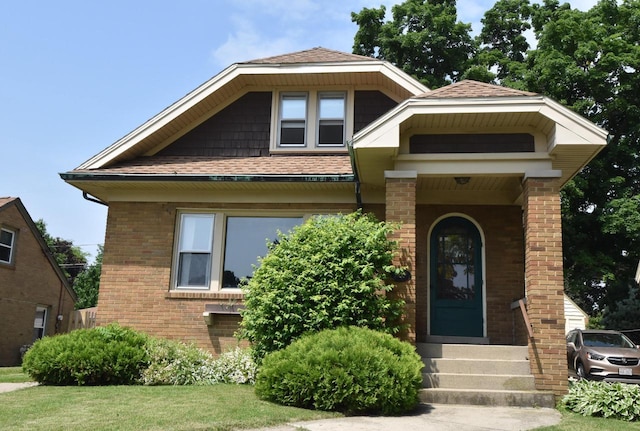 1032 Russet St, Racine, WI 53405 - view of front facade with brick siding and a shingled roof