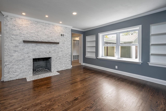 1120 N 124th St, Wauwatosa, WI 53226 - unfurnished living room featuring built in features, dark wood-type flooring, a stone fireplace, ornamental molding, and recessed lighting