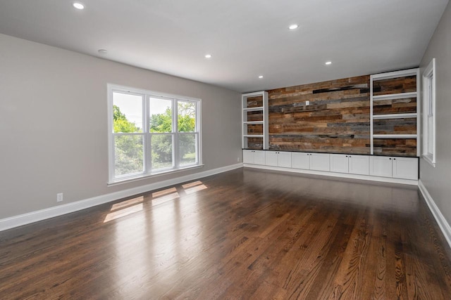 1120 N 124th St, Wauwatosa, WI 53226 - empty room with built in shelves, dark wood finished floors, and recessed lighting
