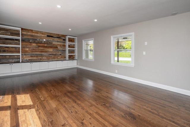 1120 N 124th St, Wauwatosa, WI 53226 - unfurnished room featuring dark wood finished floors, recessed lighting, and built in features
