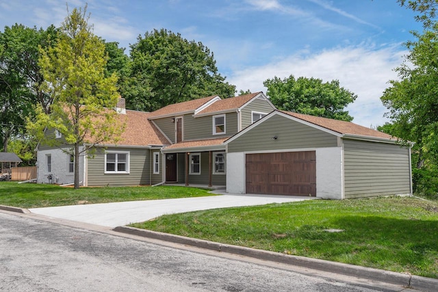 1120 N 124th St, Wauwatosa, WI 53226 - view of front facade featuring an attached garage, a front lawn, a chimney, and concrete driveway