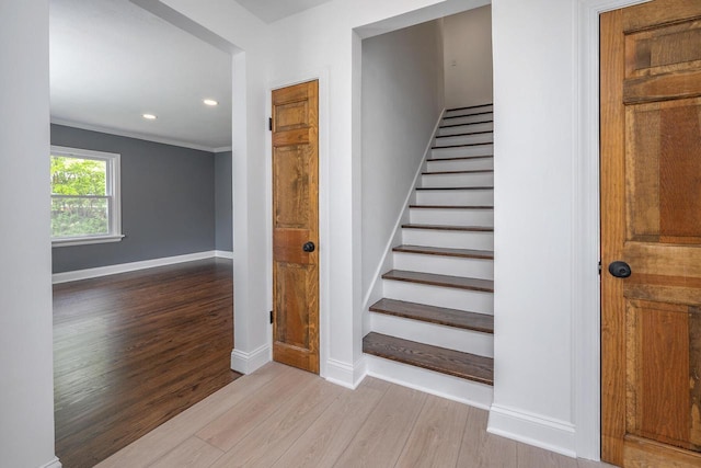 1120 N 124th St, Wauwatosa, WI 53226 - stairway with wood finished floors, recessed lighting, and ornamental molding