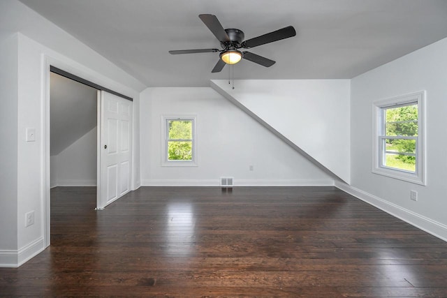 1120 N 124th St, Wauwatosa, WI 53226 - unfurnished living room featuring hardwood / wood-style flooring, healthy amount of natural light, lofted ceiling, and a ceiling fan