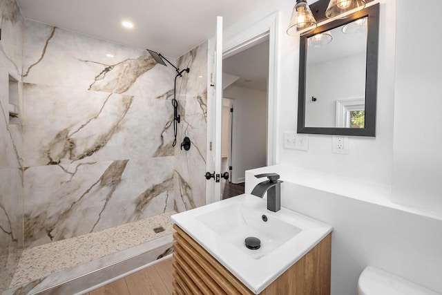 1120 N 124th St, Wauwatosa, WI 53226 - full bath featuring a marble finish shower, vanity, and wood finished floors