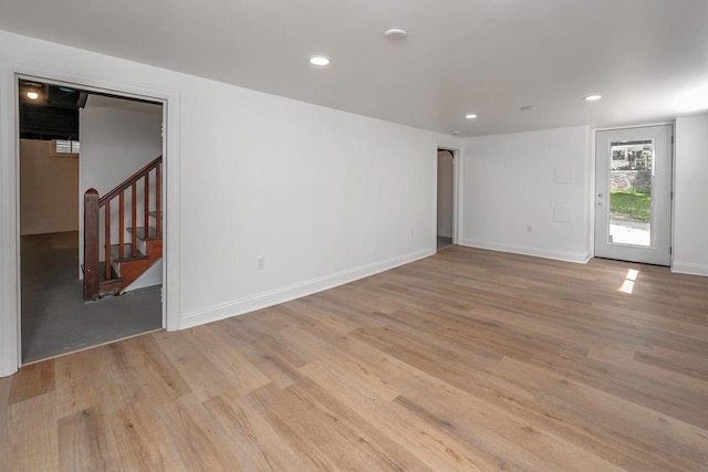 1120 N 124th St, Wauwatosa, WI 53226 - spare room with stairs, light wood-style floors, and recessed lighting