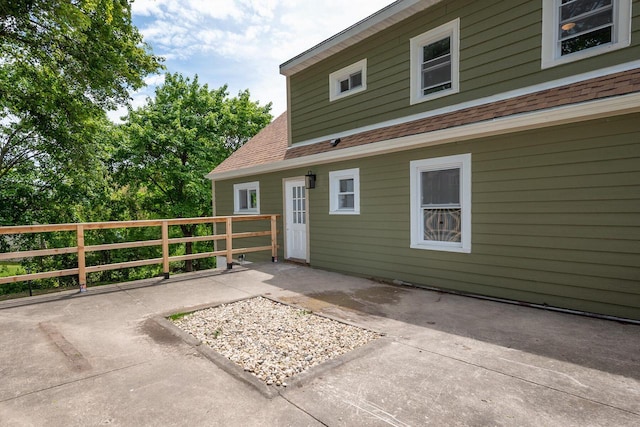 1120 N 124th St, Wauwatosa, WI 53226 - exterior space featuring roof with shingles and a patio area