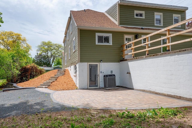 1120 N 124th St, Wauwatosa, WI 53226 - back of house featuring a patio area, stairs, and roof with shingles