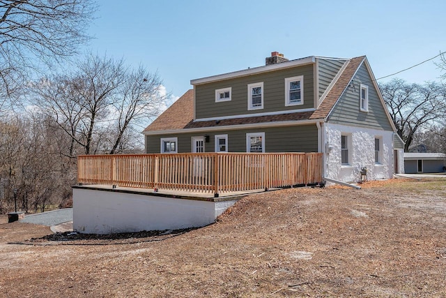 1120 N 124th St, Wauwatosa, WI 53226 - view of front of home with a deck, a chimney, and roof with shingles