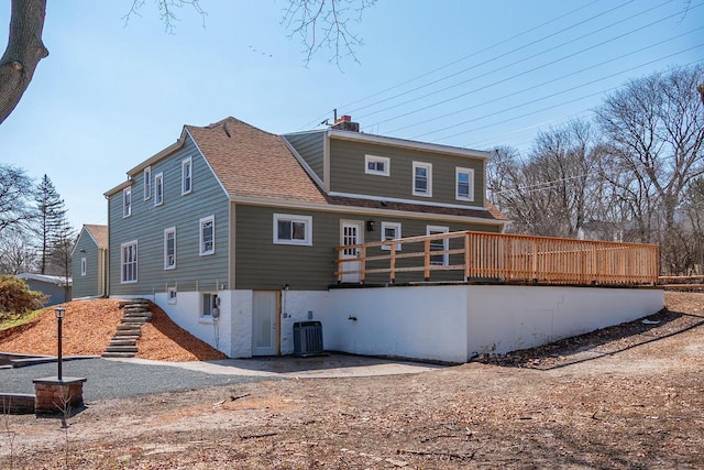 1120 N 124th St, Wauwatosa, WI 53226 - back of house featuring roof with shingles, a chimney, and a deck