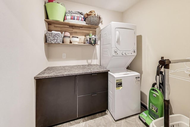 1500 E Oklahoma Ave Unit 1502, Milwaukee, WI 53207 - laundry room with stacked washing machine and dryer and light marble finish floors