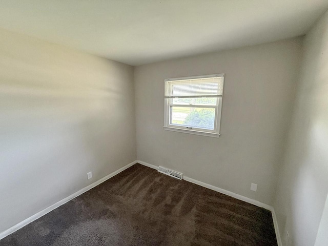 5082 N 108th St, Milwaukee, WI 53225 - unfurnished room with dark colored carpet and baseboards