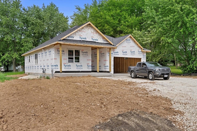LT1 Steeple View Rd, West Bend, WI 53095 - unfinished property with driveway, a garage, covered porch, and a shingled roof