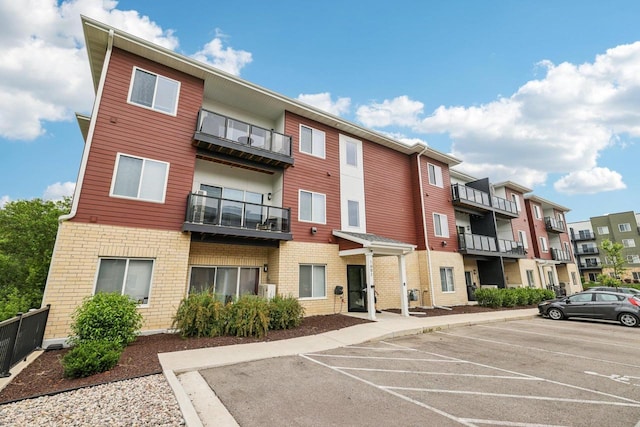 1601 N Windsor Ave Unit 106, Cottage Grove, WI 53527 - view of property with uncovered parking and a residential view