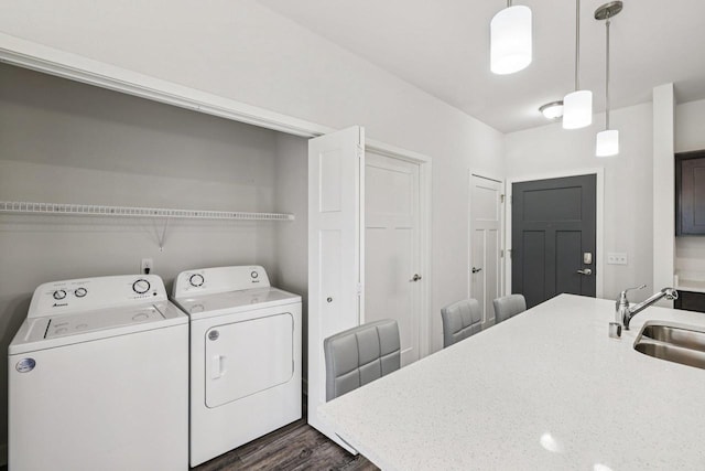 1601 N Windsor Ave Unit 106, Cottage Grove, WI 53527 - laundry area featuring separate washer and dryer and dark wood-type flooring