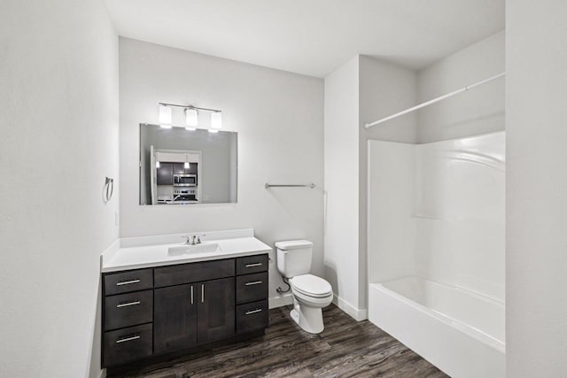 1601 N Windsor Ave Unit 106, Cottage Grove, WI 53527 - bathroom featuring vanity, wood finished floors, and washtub / shower combination