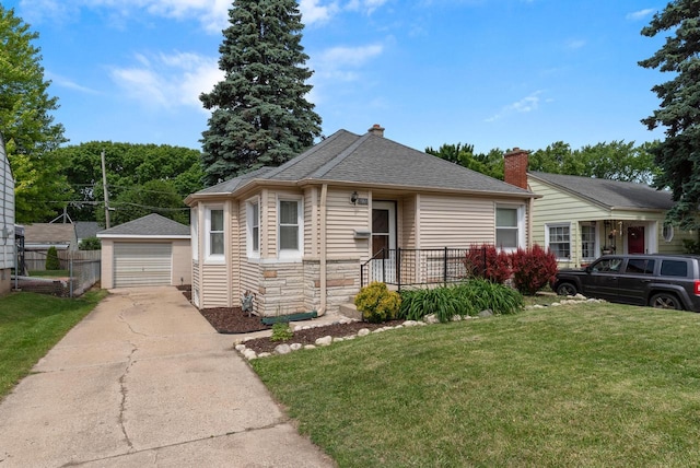 1961 S 94th St, West Allis, WI 53227 - view of front of home featuring an outdoor structure, a front yard, stone siding, a garage, and roof with shingles