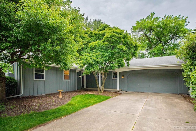1813 Countryside Dr, Middleton, WI 53562 - ranch-style house with board and batten siding, an attached garage, and driveway