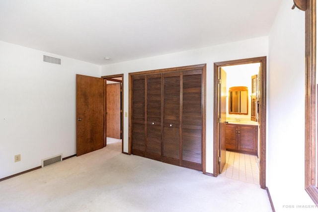 1813 Countryside Dr, Middleton, WI 53562 - unfurnished bedroom with light colored carpet, a closet, and connected bathroom