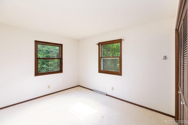 1813 Countryside Dr, Middleton, WI 53562 - unfurnished room featuring healthy amount of natural light and light colored carpet