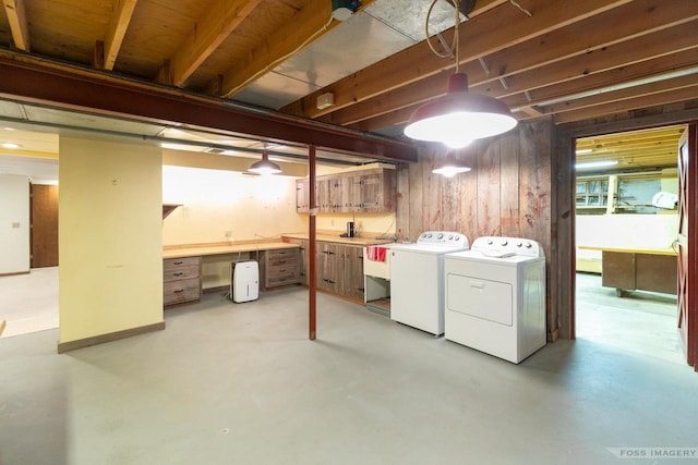 1813 Countryside Dr, Middleton, WI 53562 - basement featuring washing machine and clothes dryer, an office area, and wooden walls
