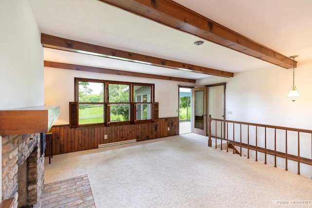 1813 Countryside Dr, Middleton, WI 53562 - unfurnished living room with a wainscoted wall, beam ceiling, baseboard heating, wood walls, and carpet flooring