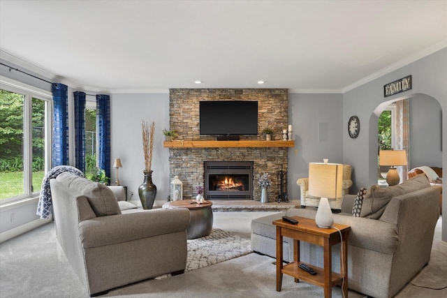N80W32229 Northbrook Ct, Hartland, WI 53029 - living room with arched walkways, healthy amount of natural light, ornamental molding, carpet, and a fireplace