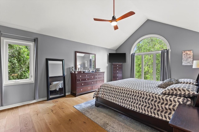 N80W32229 Northbrook Ct, Hartland, WI 53029 - bedroom featuring multiple windows, light wood-style flooring, vaulted ceiling, and a ceiling fan