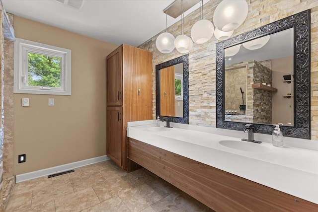 N80W32229 Northbrook Ct, Hartland, WI 53029 - full bathroom featuring double vanity and a tile shower