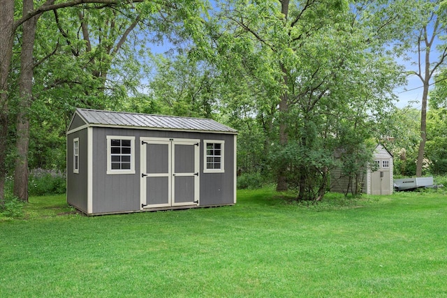 N80W32229 Northbrook Ct, Hartland, WI 53029 - view of shed with view of scattered trees