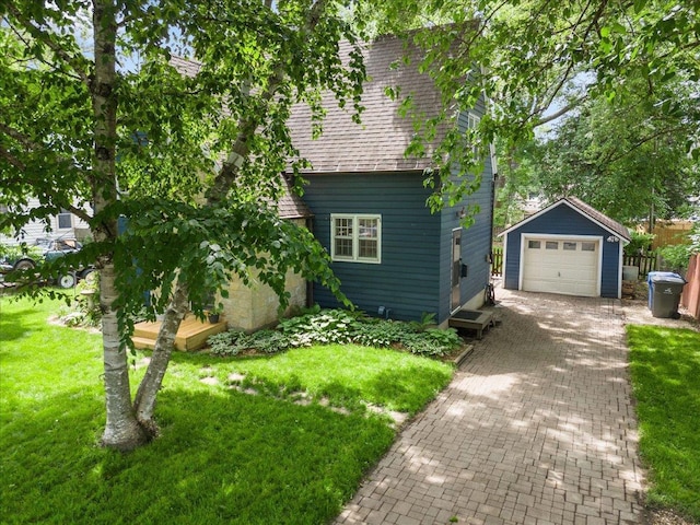 4705 Gordon Ave, Monona, WI 53716 - view of front of property with an outdoor structure, decorative driveway, a detached garage, and a front yard