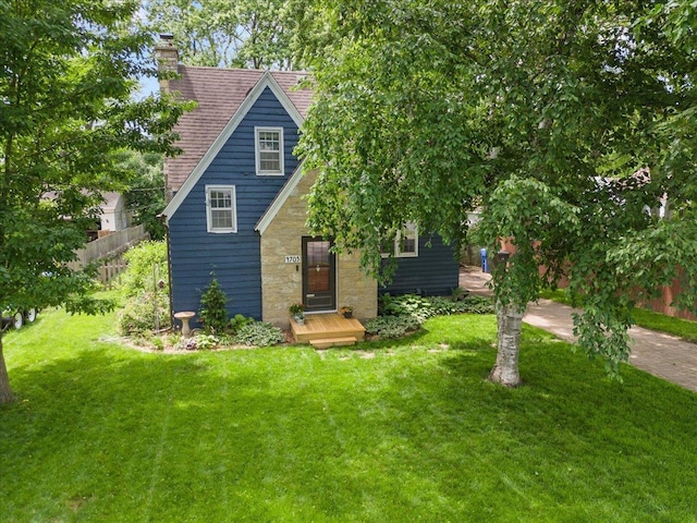 4705 Gordon Ave, Monona, WI 53716 - view of front of house with a chimney, stone siding, and roof with shingles