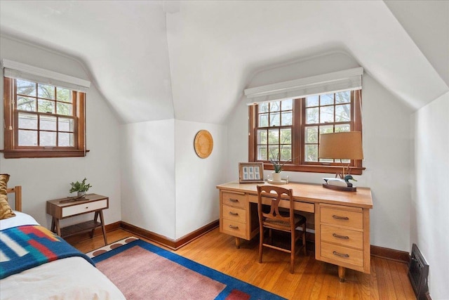 4705 Gordon Ave, Monona, WI 53716 - bedroom with light wood-style flooring, lofted ceiling, and an office area