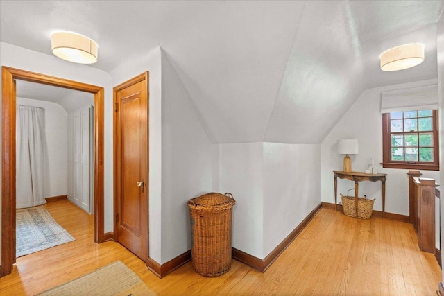 4705 Gordon Ave, Monona, WI 53716 - additional living space with light wood-style flooring and vaulted ceiling