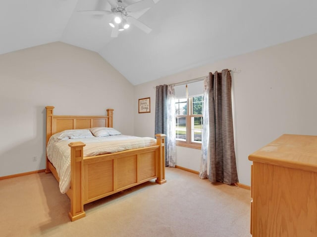 26317 Dukleth Dr, Waterford, WI 53185 - bedroom with light colored carpet, vaulted ceiling, and a ceiling fan