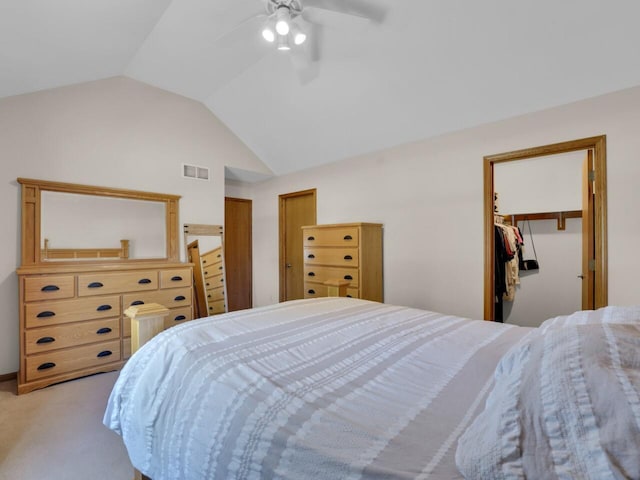 26317 Dukleth Dr, Waterford, WI 53185 - bedroom featuring light carpet, vaulted ceiling, a ceiling fan, and a spacious closet