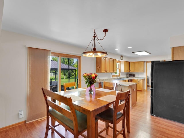 26317 Dukleth Dr, Waterford, WI 53185 - dining area featuring light wood-type flooring and recessed lighting
