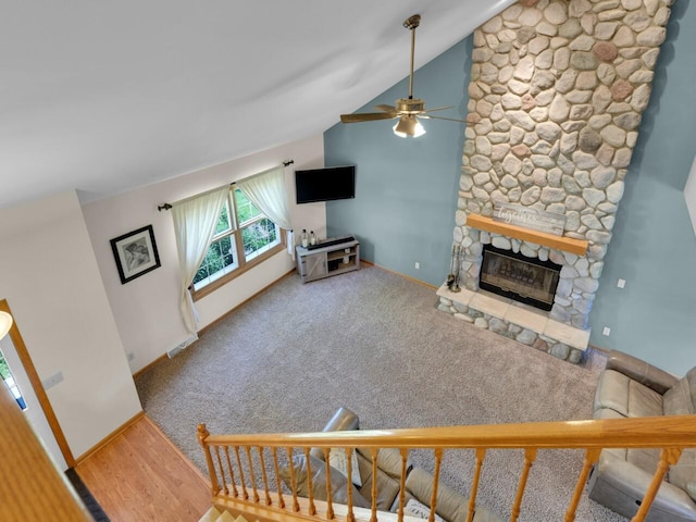 26317 Dukleth Dr, Waterford, WI 53185 - living room featuring a ceiling fan, a fireplace, and lofted ceiling