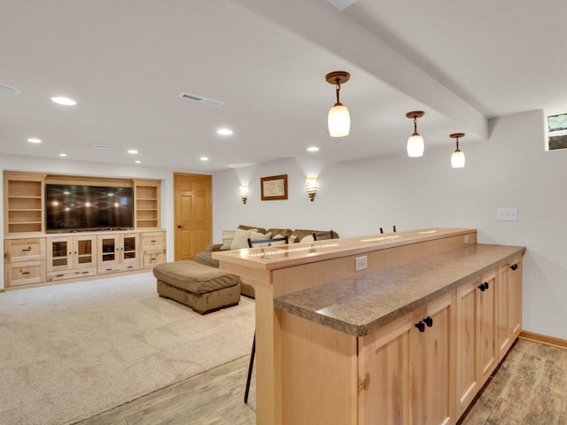 26317 Dukleth Dr, Waterford, WI 53185 - kitchen with light wood finished floors, open floor plan, recessed lighting, light brown cabinets, and a peninsula