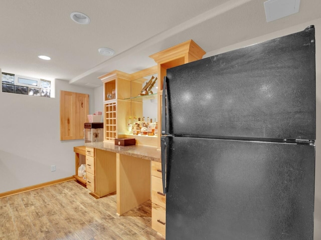 26317 Dukleth Dr, Waterford, WI 53185 - kitchen with freestanding refrigerator, light wood-style floors, light brown cabinetry, recessed lighting, and light countertops
