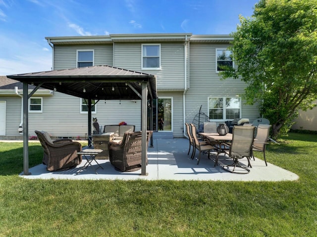 26317 Dukleth Dr, Waterford, WI 53185 - back of house with a gazebo, an outdoor living space, a lawn, and a patio