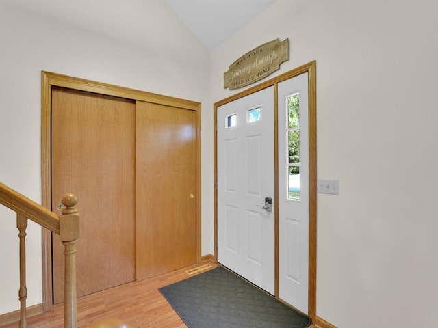 26317 Dukleth Dr, Waterford, WI 53185 - entrance foyer with light wood-type flooring, lofted ceiling, and stairway