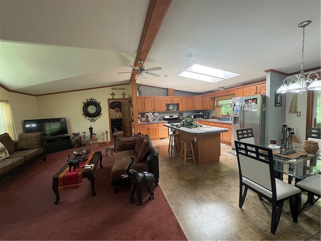 733 W Old Highway 54, Pittsville, WI 54466 - living room with a skylight, ornamental molding, a ceiling fan, and a chandelier