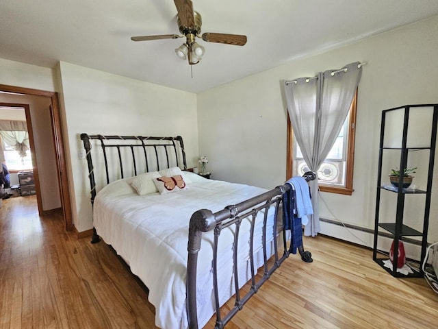 316 S Concord Ave, Marshfield, WI 54449 - bedroom featuring hardwood / wood-style floors, multiple windows, and ceiling fan