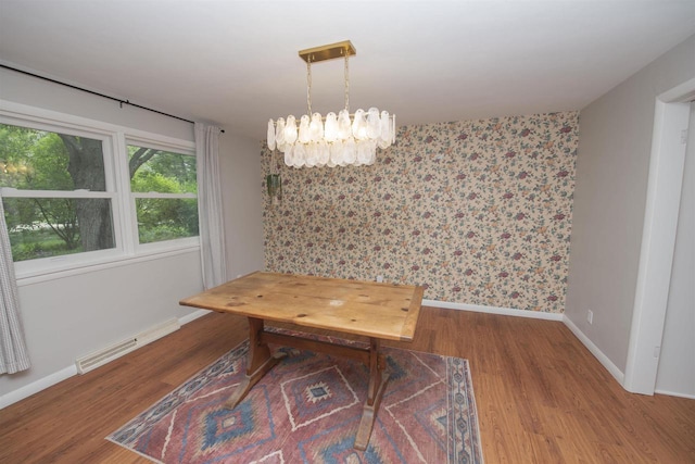 4201 Janick Cir, Stevens Point, WI 54481 - unfurnished dining area with wood finished floors, a chandelier, and wallpapered walls