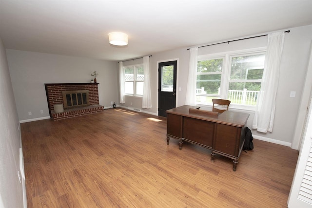 4201 Janick Cir, Stevens Point, WI 54481 - home office with wood finished floors and a brick fireplace