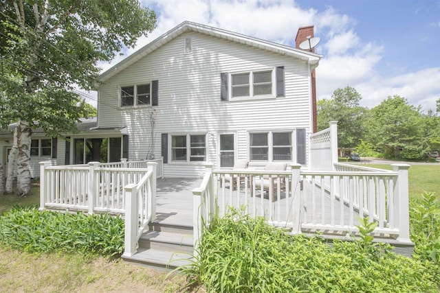 4201 Janick Cir, Stevens Point, WI 54481 - back of property featuring a chimney and a deck