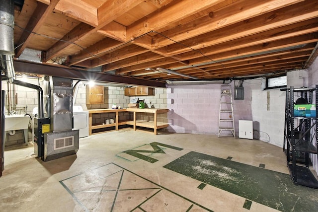 W169N11470 Biscayne Dr Unit 7, Germantown, WI 53022 - unfinished basement with washer / dryer, electric panel, heating unit, and concrete block wall