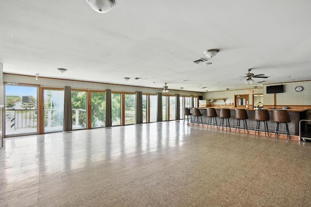 W169N11470 Biscayne Dr Unit 7, Germantown, WI 53022 - unfurnished living room featuring a community bar and ceiling fan