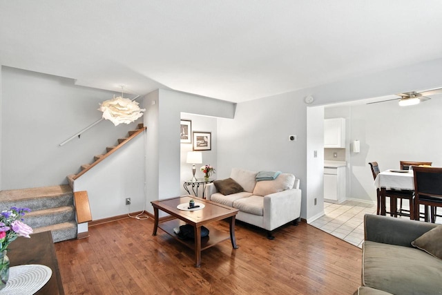 W169N11470 Biscayne Dr Unit 7, Germantown, WI 53022 - living room featuring stairs, a ceiling fan, and hardwood / wood-style flooring